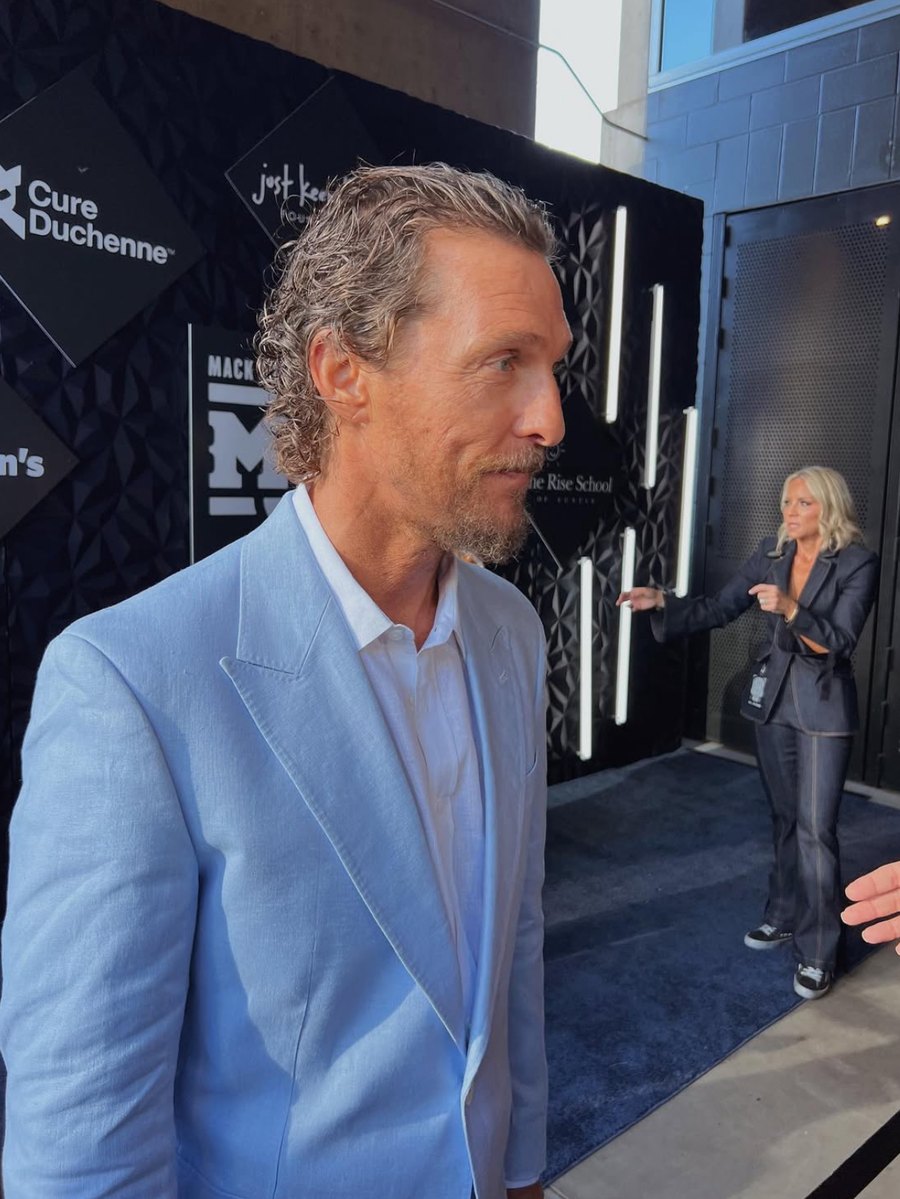Matthew McConaughey in a light blue suit on the Mack, Jack & McConaughey benefit carpet.